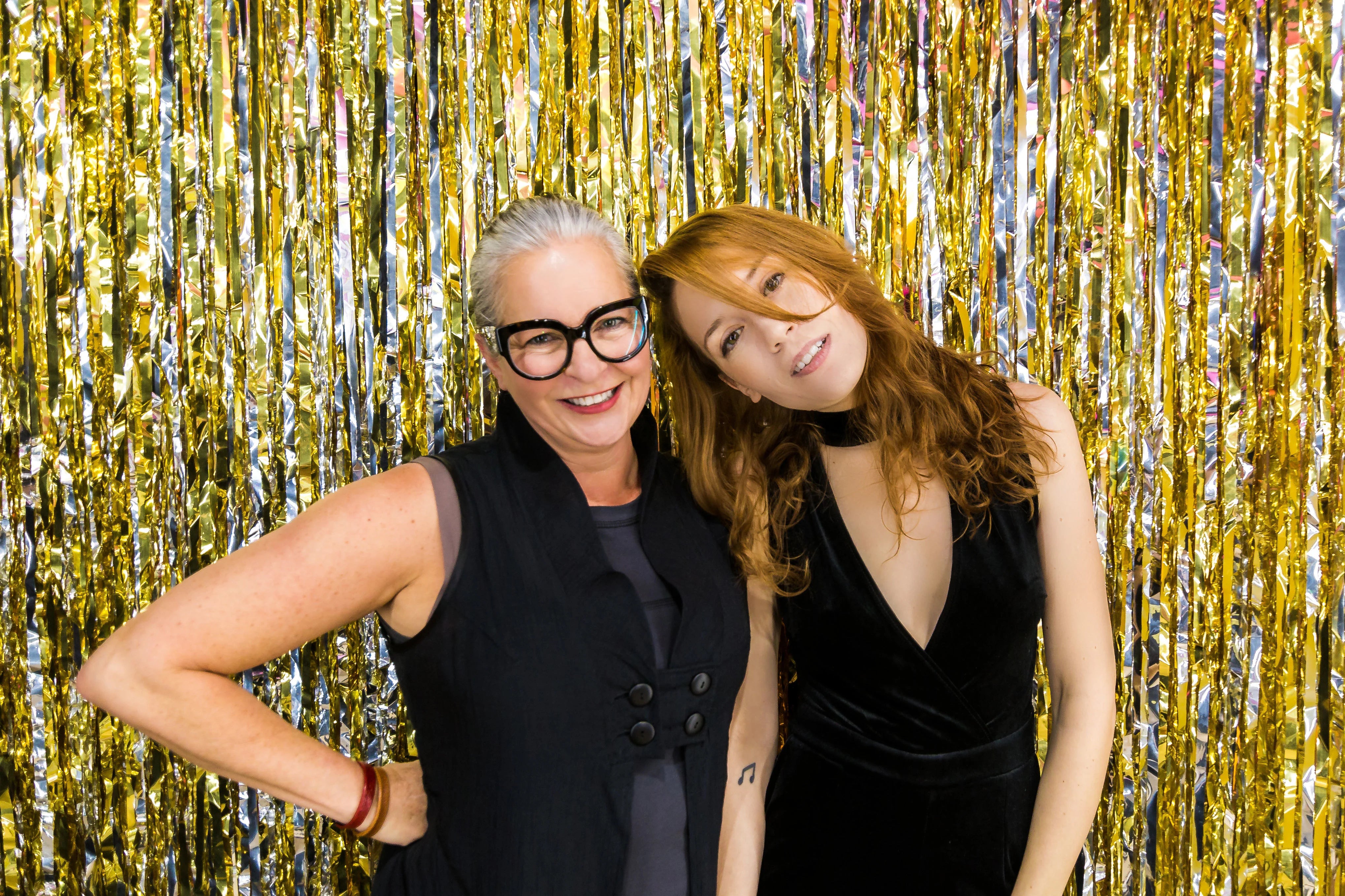 files/women-pose-with-gold.webp